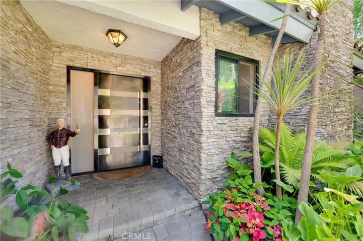 The Stainless Steel, Black Glass and Wood Front Door is a "showstopper"