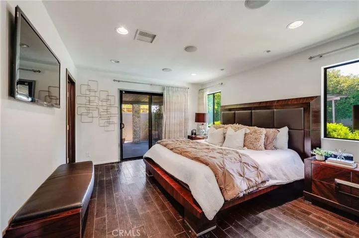 Sliding Glass Door in Primary Bedroom leads to the Backyard and Pool area