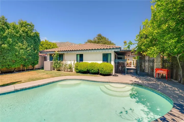 Mature Trees around the Backyard, Pool, and Lawn area offer tons of privacy