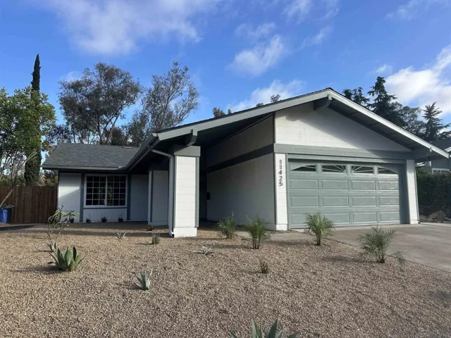 Fresh drought-tolerant landscaping and fresh paint this home a crisp, clean look.