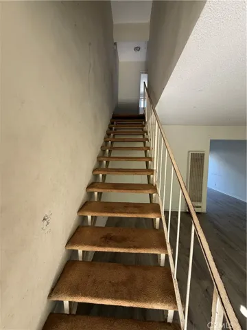 Stairs in vacant two story unit