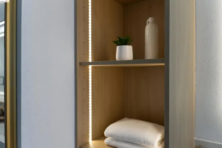 Built-in shelving featuring wood-finish construction and integrated LED strip lighting