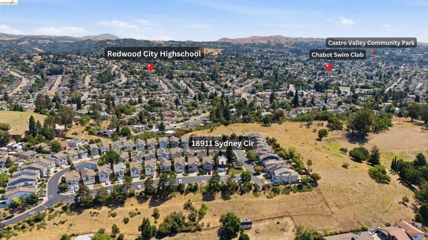 Aerial perspective showcasing a residential development with individual homes and multi-unit buildings