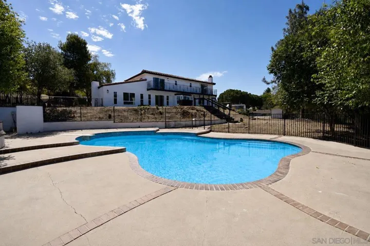LARGE POOL AREA WITH PEBBLE TEC