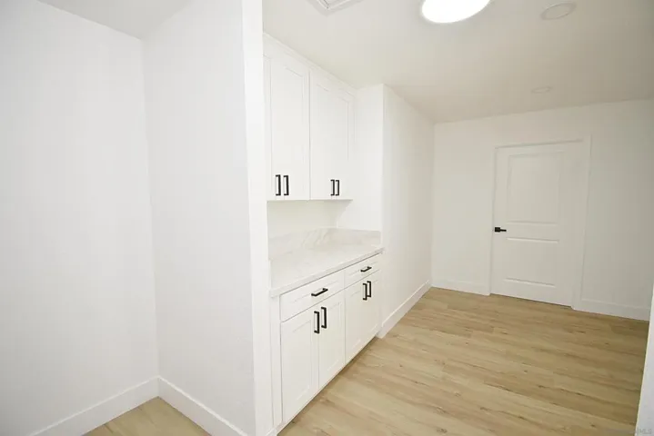 HALLWAY WITH STORAGE UPSTAIRS