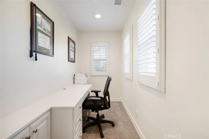 Office Area with built in desk and storage