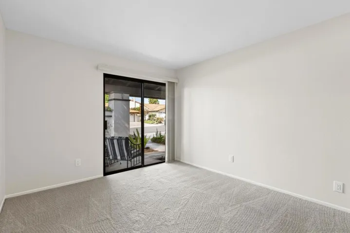 With sliding glass door to front patio area