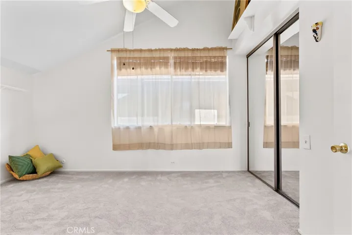 Large secondary bedroom with mirrored wradrobe