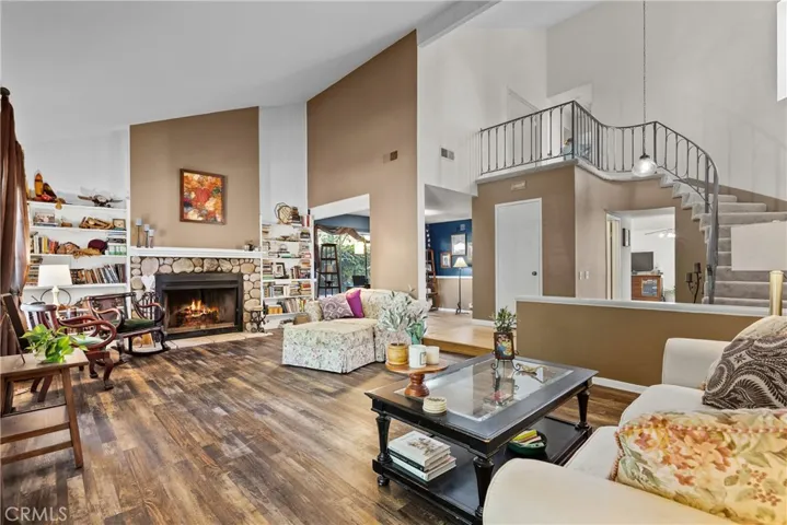 Living Room w/  stone Fireplace and beautiful wood floors