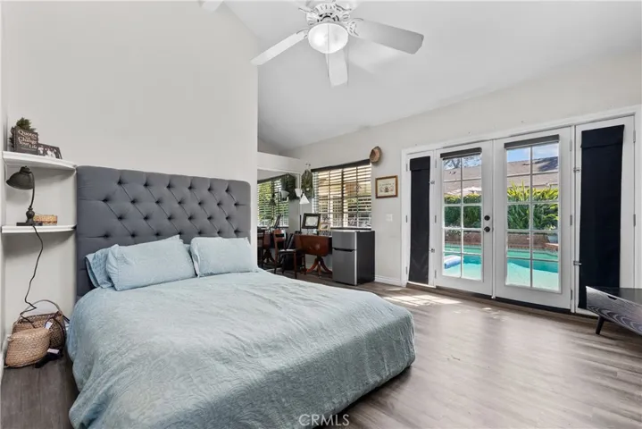 ADU Bedroom with french doors overlooking the pool .
