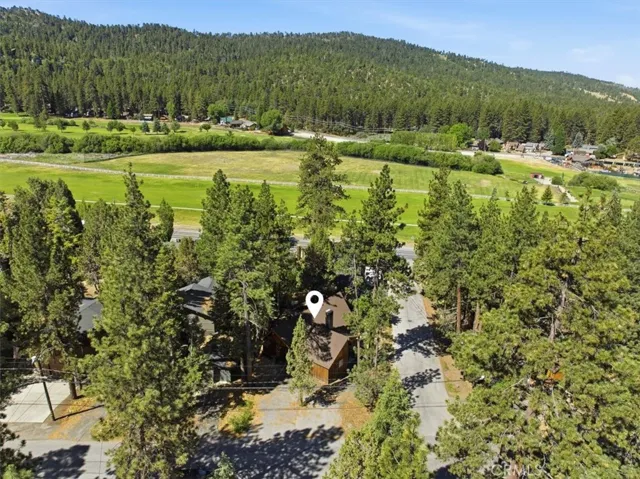 Aerial view showing the property location near golf course