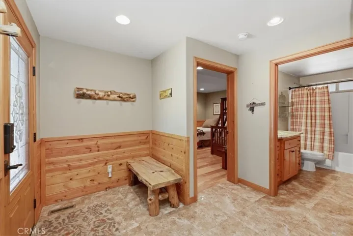 Interior entry view with access to the bedroom and bathroom nearby.