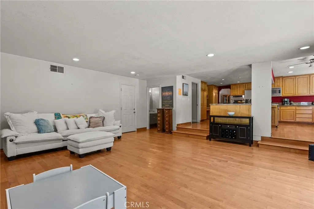 Family room, half bathroom and open to kitchen.