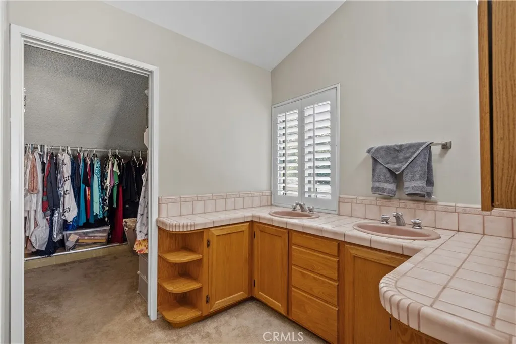Primary bathroom with spacious walk in closet.