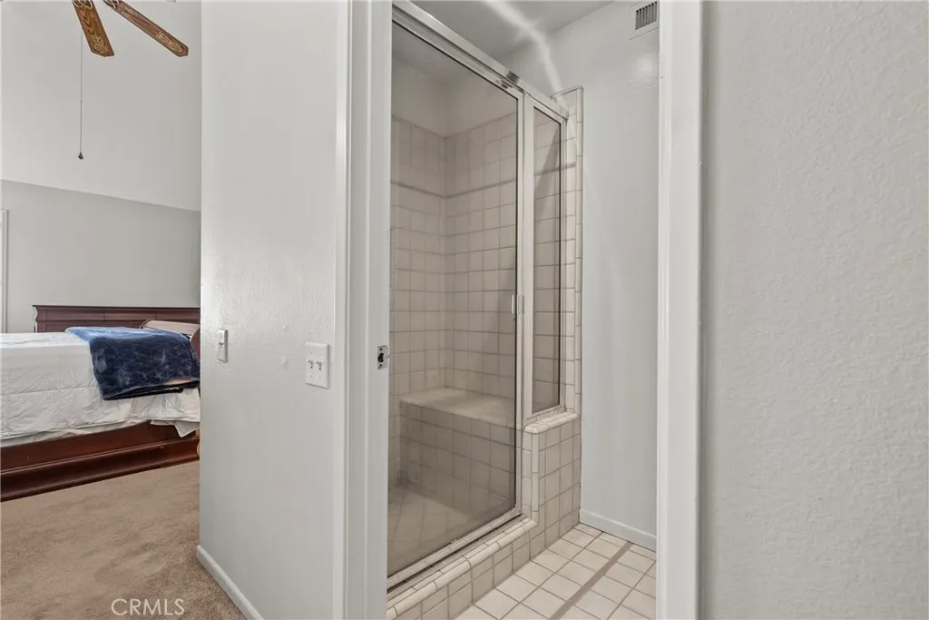 Walk in shower with bend seat.