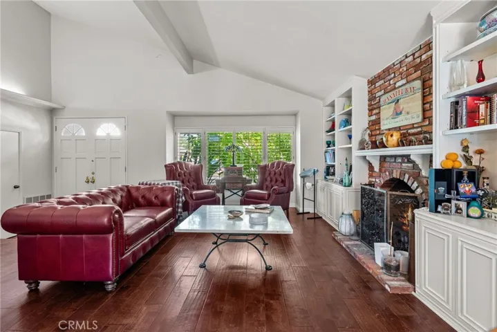 Living room with built in cabinetry and shelves.
