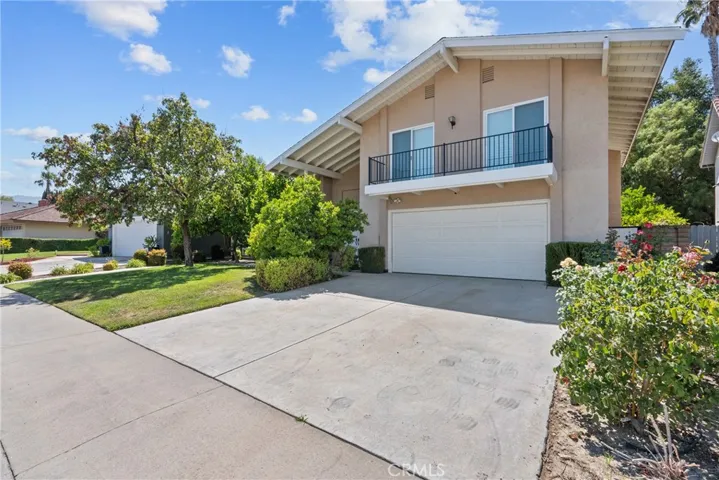 Front of home with balcony off 2 bedrooms.