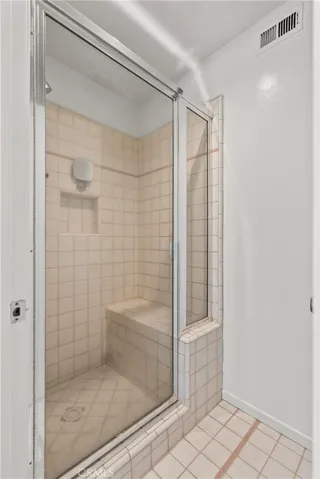 Walk in shower with bench seat.