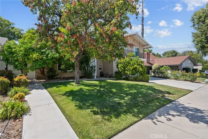 Front yard with walkway to side gate.