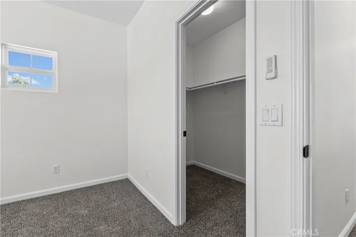 Guest Bedroom 1 with large walk-in closet