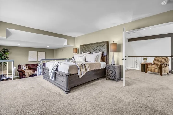 Double door expansive primary bedroom with spacious retreat perfect as a nursery, excercise room or office.