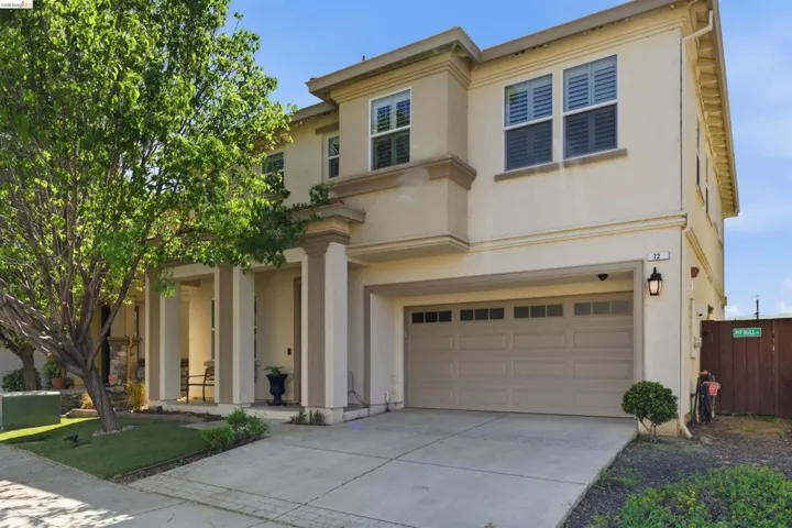 Mediterranean / spanish-style home featuring an attached garage, stucco siding, and concrete driveway