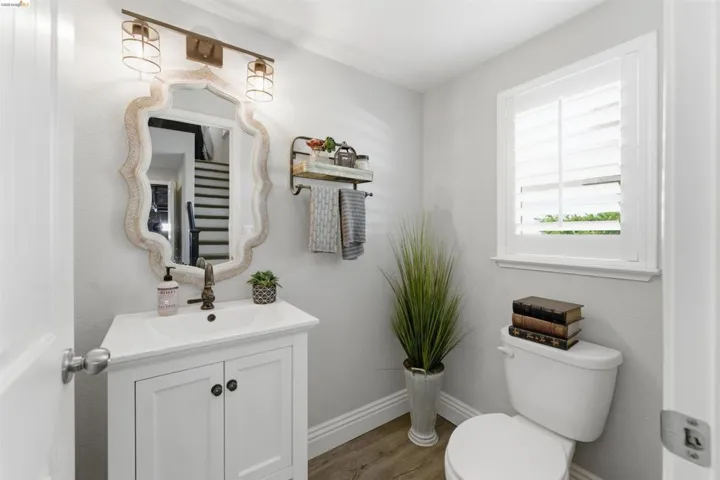 Bathroom featuring vanity and wood finished floors