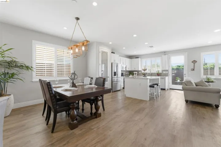 Dining area featuring light wood-type flooring and recessed lighting