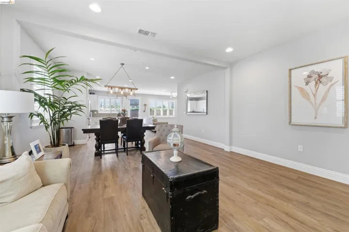 Living area featuring light wood-style floors and recessed lighting