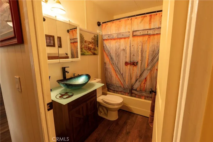 Guest Bathroom with glass counter and decorative basin