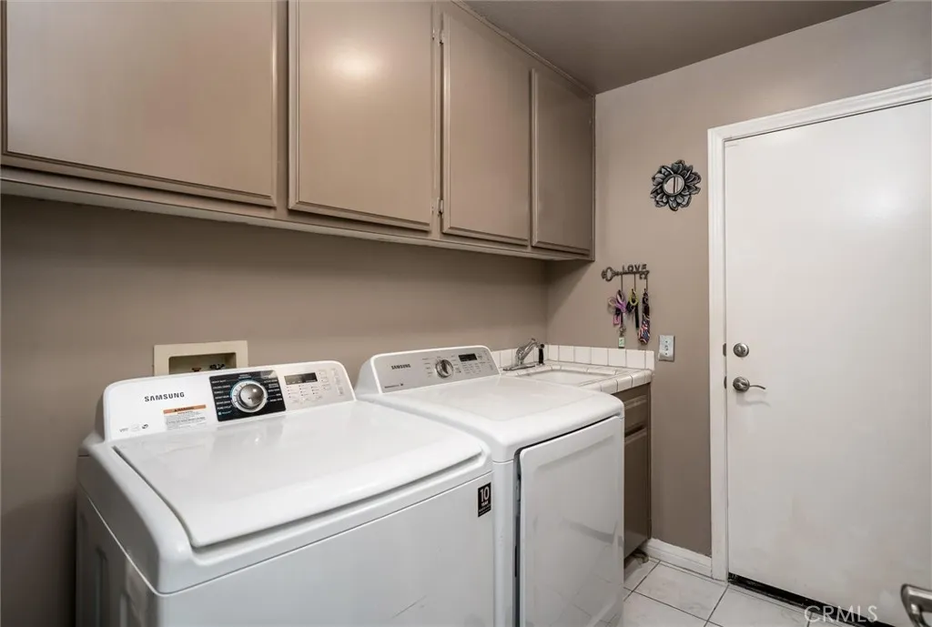 Indoor Laundry with sink & door to garage.