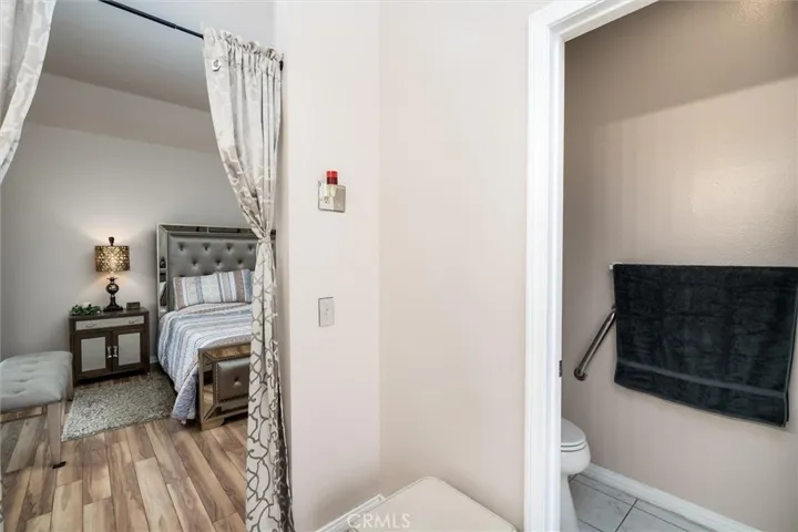 View of Primary Bedroom from Bathroom.