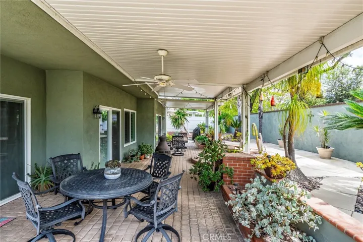 Backyard with Aluma-wood Patio & Brick floor.