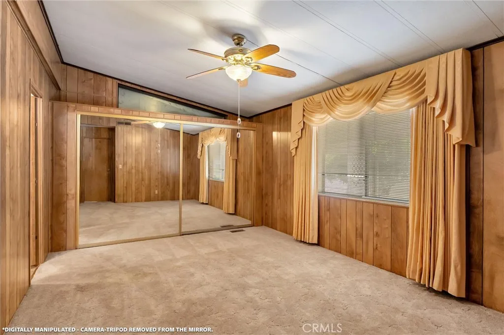 Primary bedroom with vaulted ceiling and over closet extra space