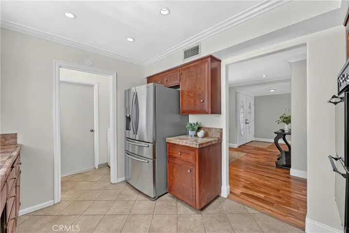 Kitchen leads into the indoor laundry room with access to the attached garage.