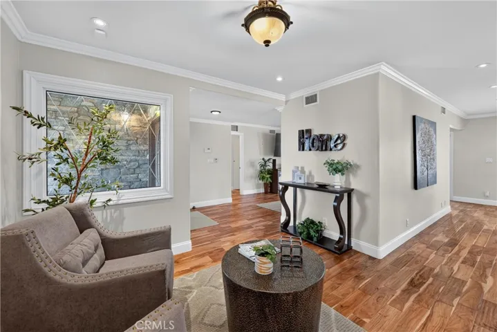 Den Opens into the Living Room and Front Entry