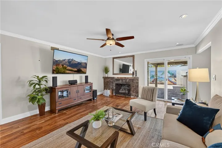 Large Living Room with Fireplace and Sliding Door to the Backyard