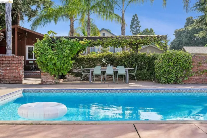 Sparkling swimming pool with patterned tile border