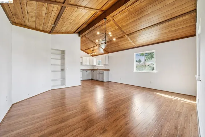 Vaulted wood-paneled ceiling with exposed beams