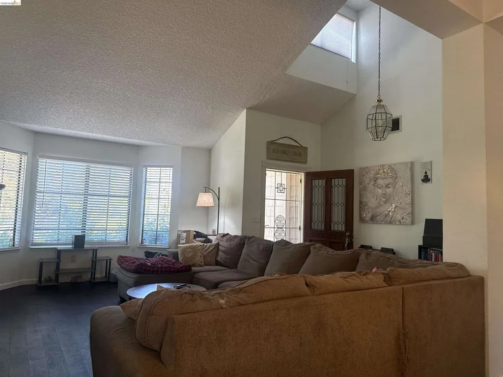 Vaulted ceilings with a prominent skylight enhance this living area