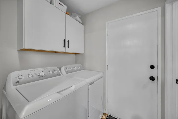 Inside laundry room leading to attached garage

