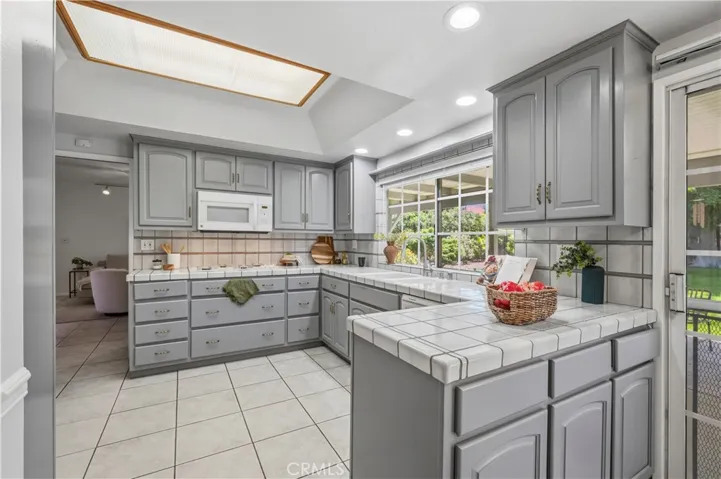 Kitchen looks out at beautiful backyard