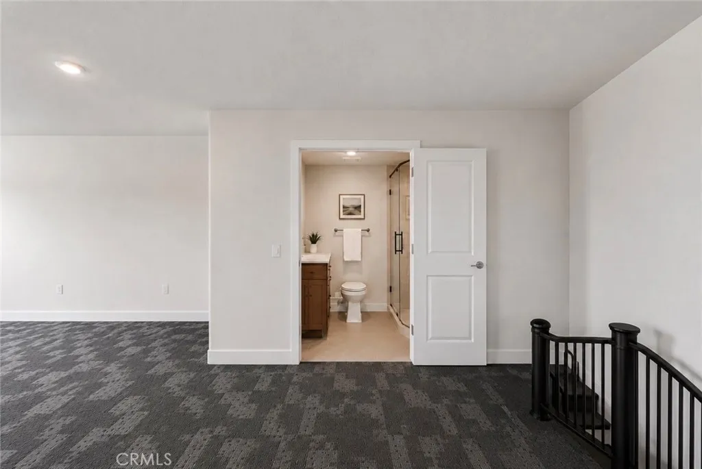 This space is plumbed for a future bathroom. Photo is digitally enhanced to illustrate one possible design.