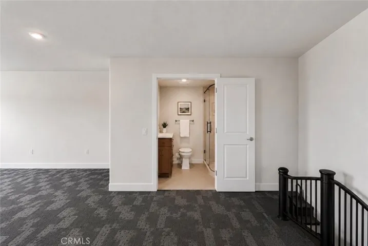 This space is plumbed for a future bathroom. Photo is digitally enhanced to illustrate one possible design.