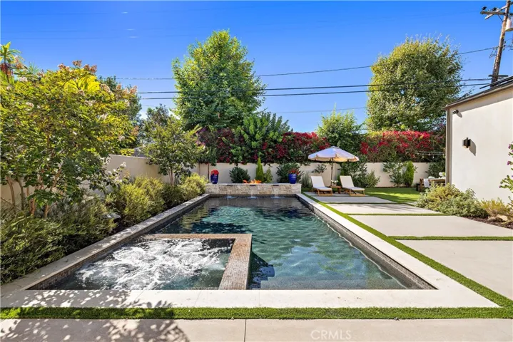 Zen backyard with salt water pool and spa