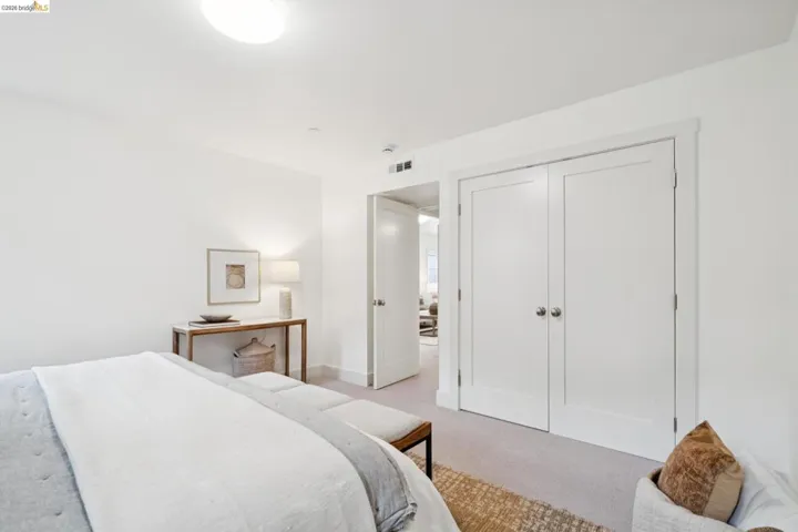 Carpeted room featuring a ceiling-mounted light fixture, white walls, and white trim
