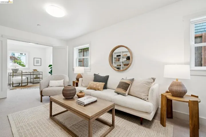 Bright interior space featuring light-colored walls and carpeted flooring