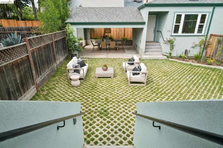 Expansive patio featuring a permeable paver system with grass infill
