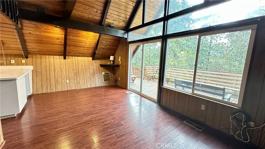 Living and Dining Area with high ceilings abd great views.