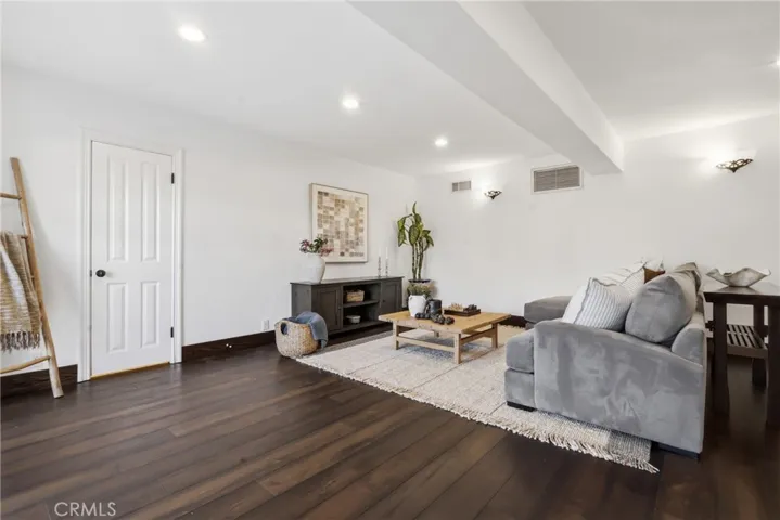 Downstairs, family room, door leads to downstairs bathroom